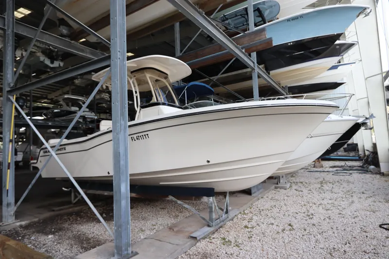Slide: The Image of 2024 Grady-White Fisherman 216 boat in storage, side view. - 0