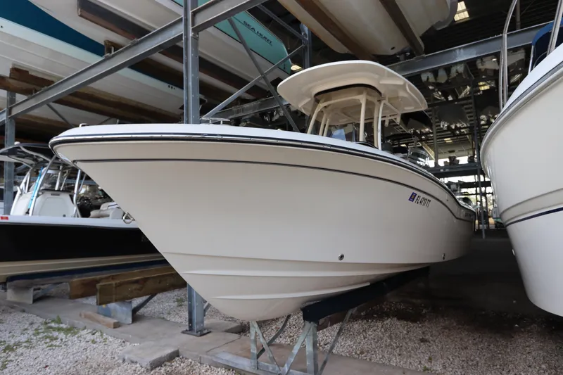 Slide: The Image of 2024 Grady-White Fisherman 216 boat in storage, side view. - 1