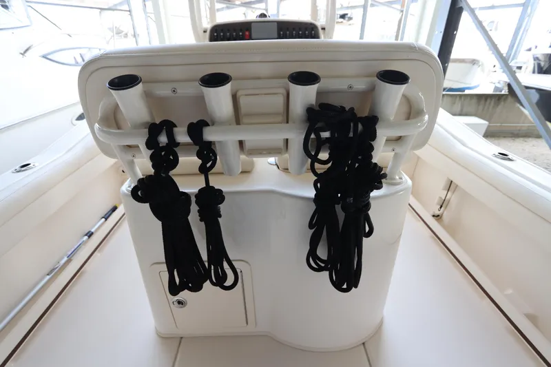 Slide: The Image of 2024 Grady-White Fisherman 216 boat interior with rod holders and ropes. - 13