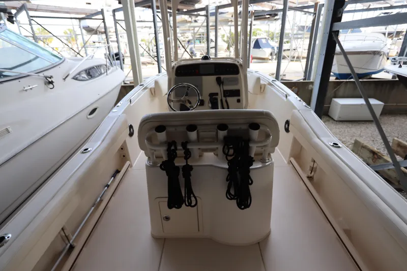 Slide: The Image of 2024 Grady-White Fisherman 216 boat interior with steering console and storage. - 15