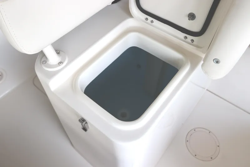 Slide: The Image of 2024 Grady-White Fisherman 216 livewell with open lid, showcasing interior. - 18