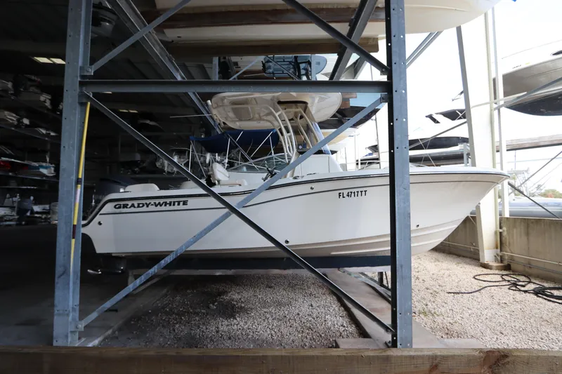 Slide: The Image of 2024 Grady-White Fisherman 216 boat stored in a marina rack. - 2