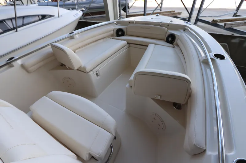 Slide: The Image of 2024 Grady-White Fisherman 216 boat interior with cushioned seating and storage. - 30