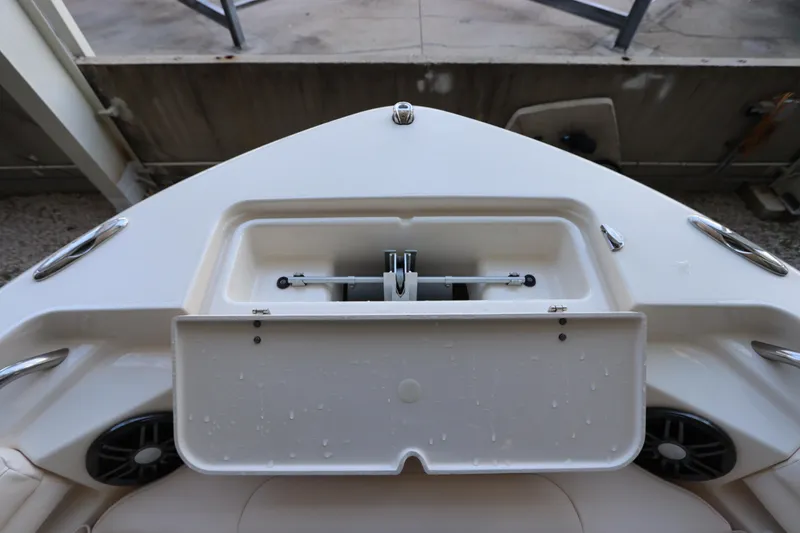 Slide: The Image of 2024 Grady-White Fisherman 216 boat storage compartment, open lid, white interior. - 32