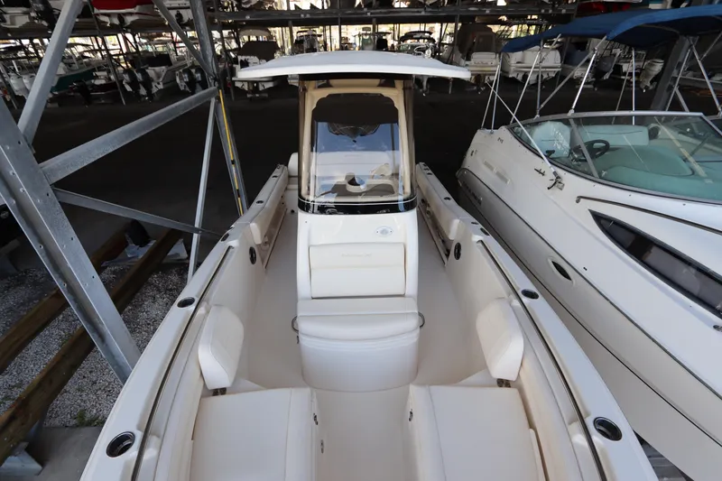 Slide: The Image of 2024 Grady-White Fisherman 216 boat in storage, showcasing sleek design and spacious seating. - 33