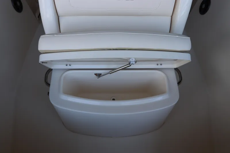 Slide: The Image of 2024 Grady-White Fisherman 216 boat seat with storage compartment open. - 34