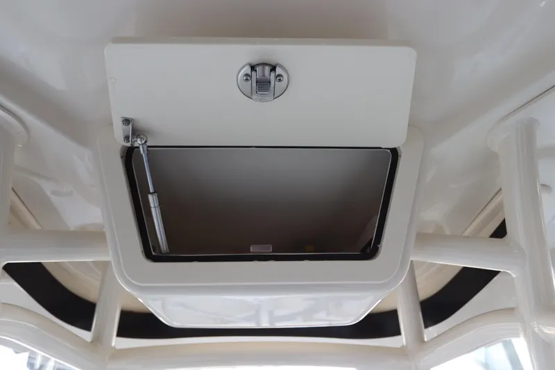 Slide: The Image of 2024 Grady-White Fisherman 216 boat hatch detail with secure latch mechanism. - 37