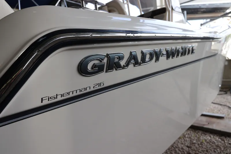 Slide: The Image of 2024 Grady-White Fisherman 216 boat side view with logo detail. - 4