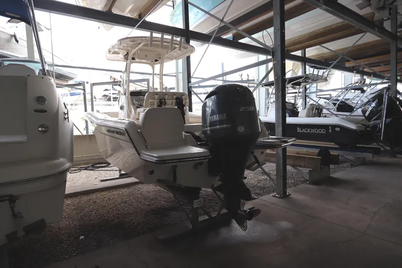 Slide: The Image of 2024 Grady-White Fisherman 216 boat in storage, rear view with Yamaha engine. - 5