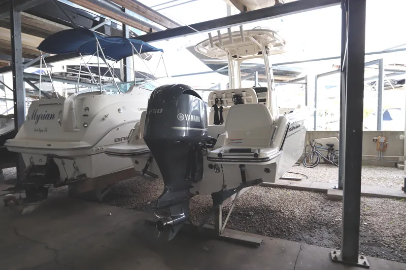 Slide: The Image of 2024 Grady-White Fisherman 216 boat with Yamaha engine in storage facility. - 6