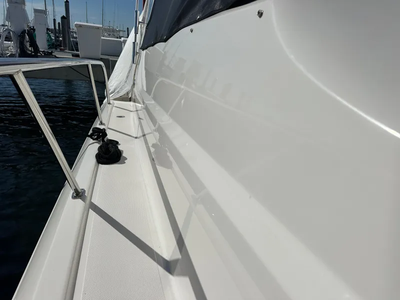 Slide: The Image of 2017 Pursuit OS 355 Offshore boat deck with railing and marina view. - 10