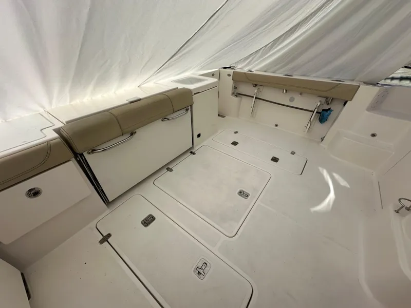 Slide: The Image of 2017 Pursuit OS 355 Offshore boat interior with spacious deck and seating. - 12