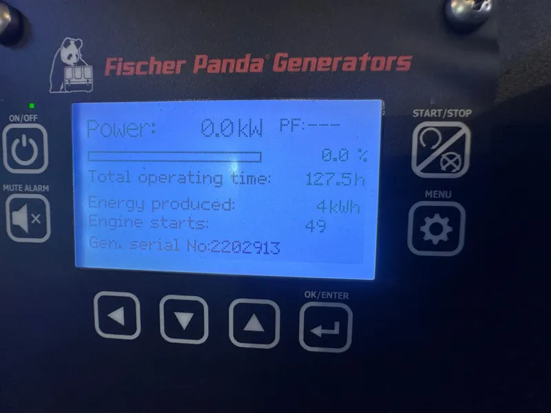 Slide: The Image of Fischer Panda generator display showing power, operating time, and engine starts on Pursuit OS 355 Offshore. - 21
