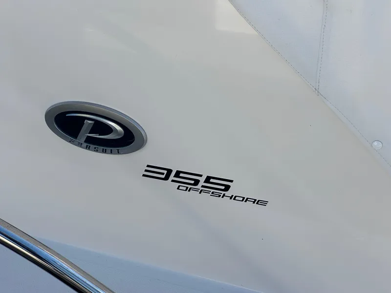 Slide: The Image of 2017 Pursuit OS 355 Offshore boat emblem and model name. - 8