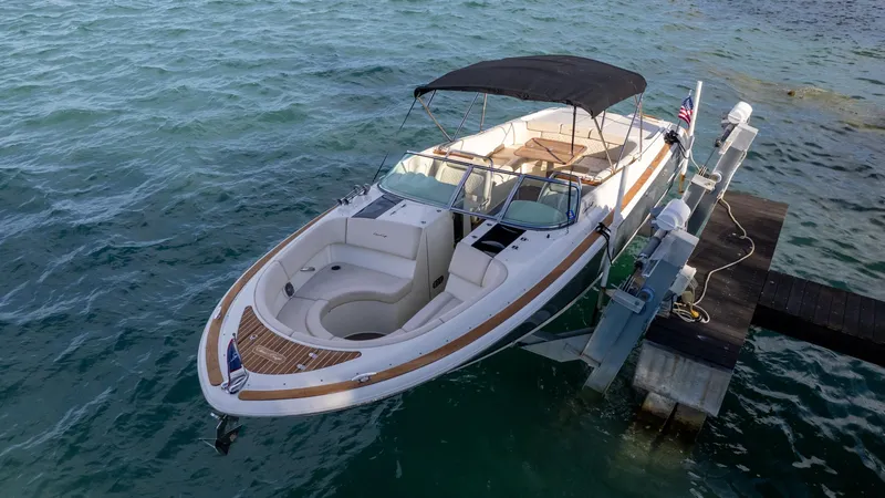 Slide: The Image of 2014 Chris-Craft Launch 32 boat docked on calm water. - 15