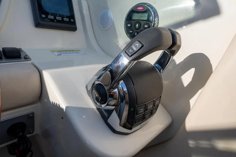 Slide: The Image of 2014 Chris-Craft Launch 32 throttle control and dashboard detail. - 22