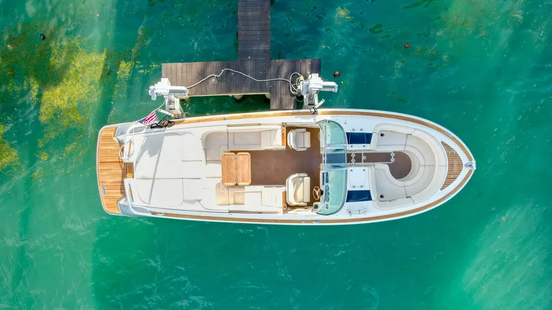 Slide: The Image of Aerial view of 2014 Chris-Craft Launch 32 docked on turquoise water. - 4