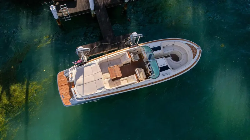 Slide: The Image of 2014 Chris-Craft Launch 32 boat docked in clear water, aerial view. - 6