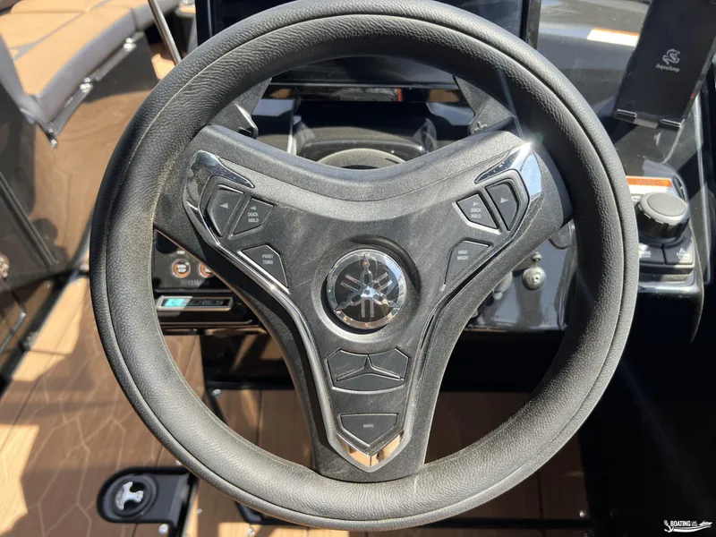 Slide: The Image of Steering wheel of 2025 Yamaha Boats 255XD, featuring modern controls and sleek design. - 10