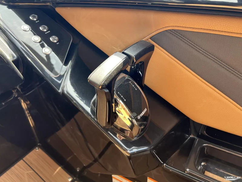 Slide: The Image of Yamaha Boats 255XD 2025 throttle control with sleek design and modern buttons. - 13