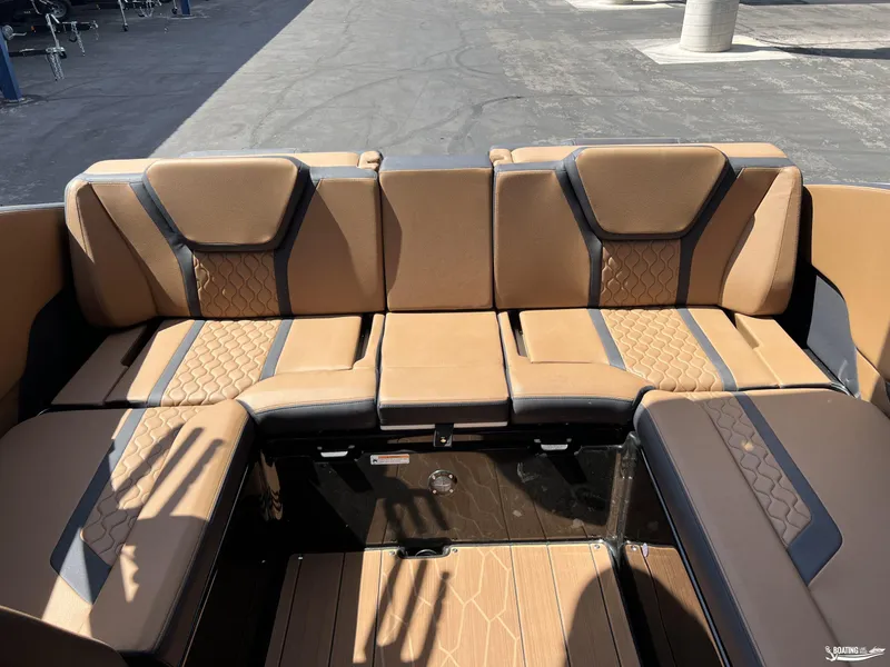 Slide: The Image of Luxurious seating on 2025 Yamaha Boats 255XD, featuring tan and black upholstery. - 16
