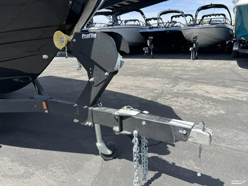 Slide: The Image of Trailer hitch of a 2025 Yamaha Boats 255XD in a parking lot. - 20