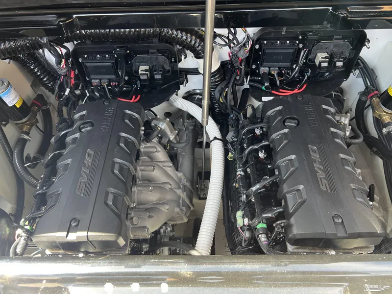 Slide: The Image of 2025 Yamaha Boats 255XD engine compartment with dual SVHO engines and wiring. - 21