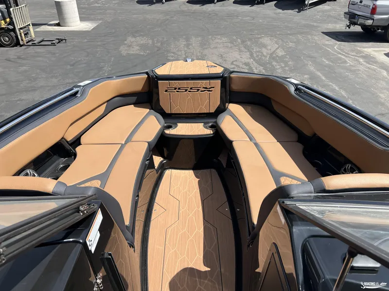 Slide: The Image of 2025 Yamaha Boats 255XD interior with tan seating and sleek design. - 6