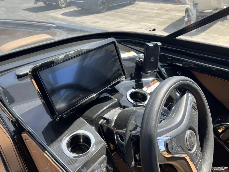 Slide: The Image of 2025 Yamaha Boats 255XD dashboard with touchscreen and steering wheel. - 8