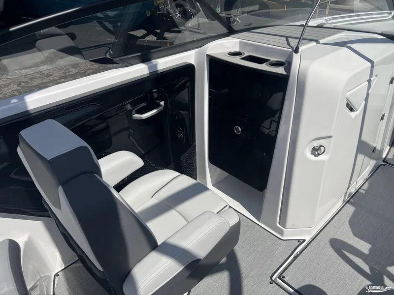 Slide: The Image of 2025 Yamaha Boats AR250 interior with sleek seating and modern dashboard design. - 12