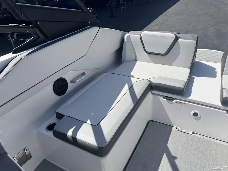 Slide: The Image of 2025 Yamaha Boats AR250 interior seating with sleek, modern design and comfortable upholstery. - 13