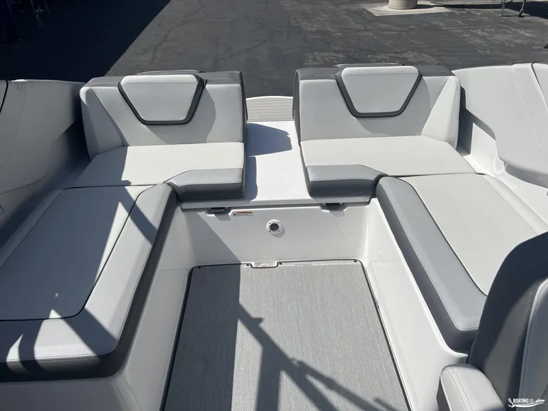 Slide: The Image of 2025 Yamaha Boats AR250 interior seating with gray and white upholstery. - 14