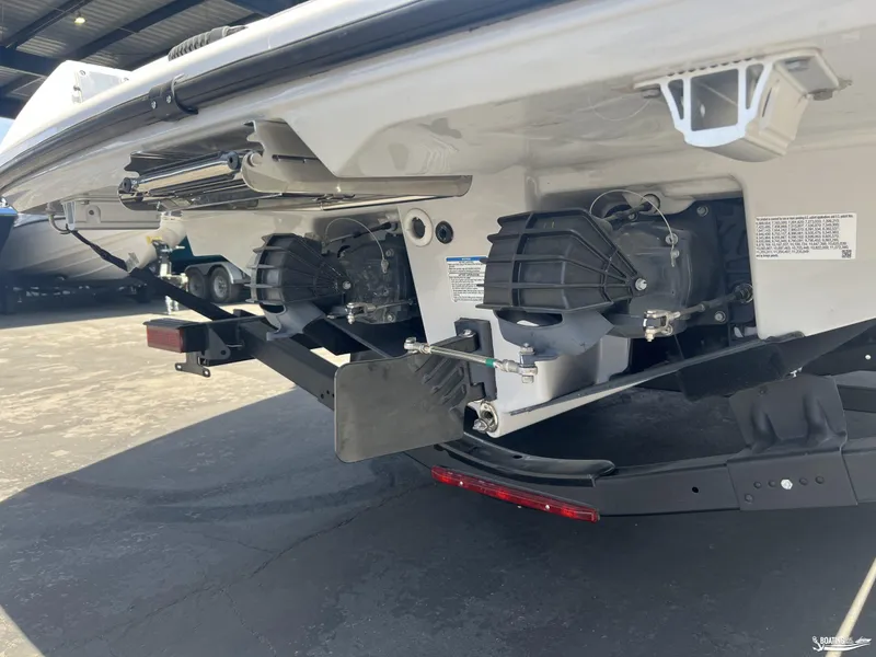 Slide: The Image of 2025 Yamaha Boats AR250 jet propulsion system close-up in a marina setting. - 17