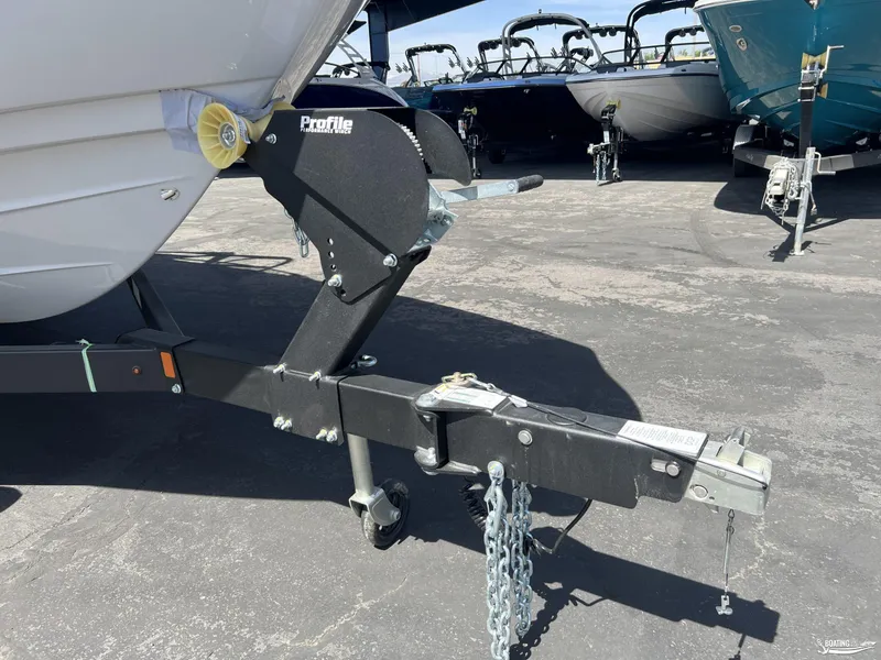 Slide: The Image of 2025 Yamaha Boats AR250 trailer hitch and winch in a parking lot. - 19