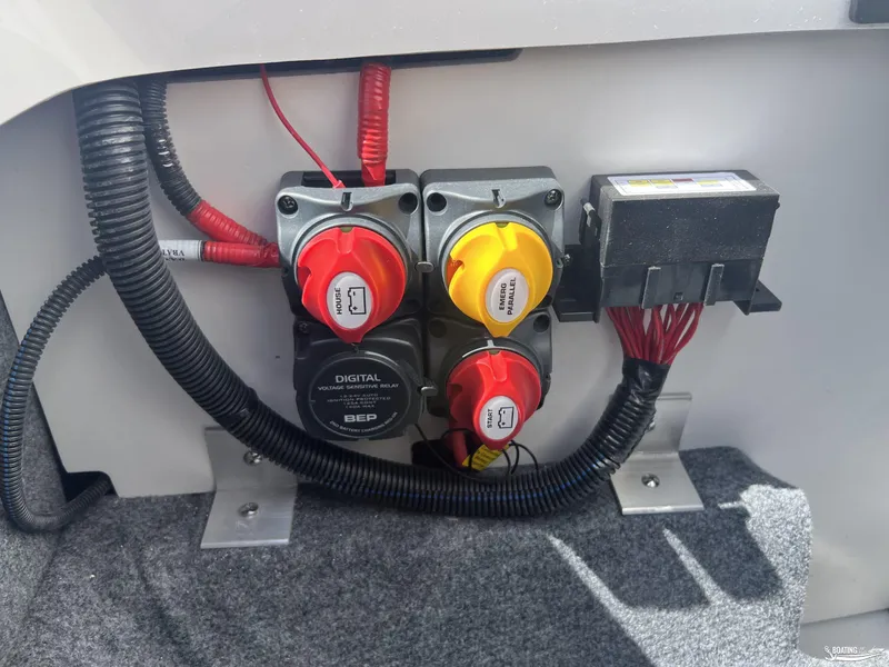 Slide: The Image of Electrical panel of 2025 Yamaha Boats AR250 with switches and wiring. - 21