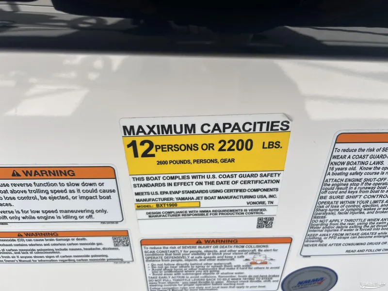 Slide: The Image of 2025 Yamaha Boats AR250 capacity label, maximum 12 persons or 2200 lbs, safety warnings included. - 22