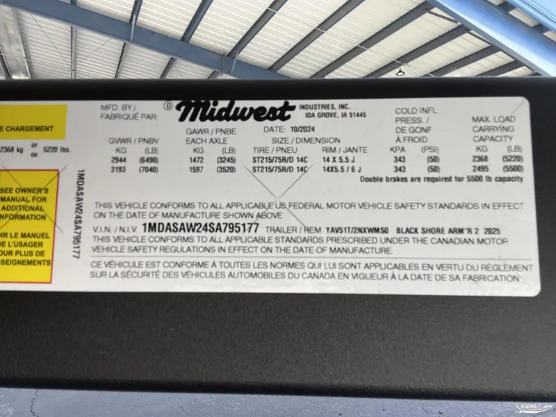 Slide: The Image of Label on a 2025 Yamaha Boats AR250 trailer, detailing safety standards and specifications. - 23