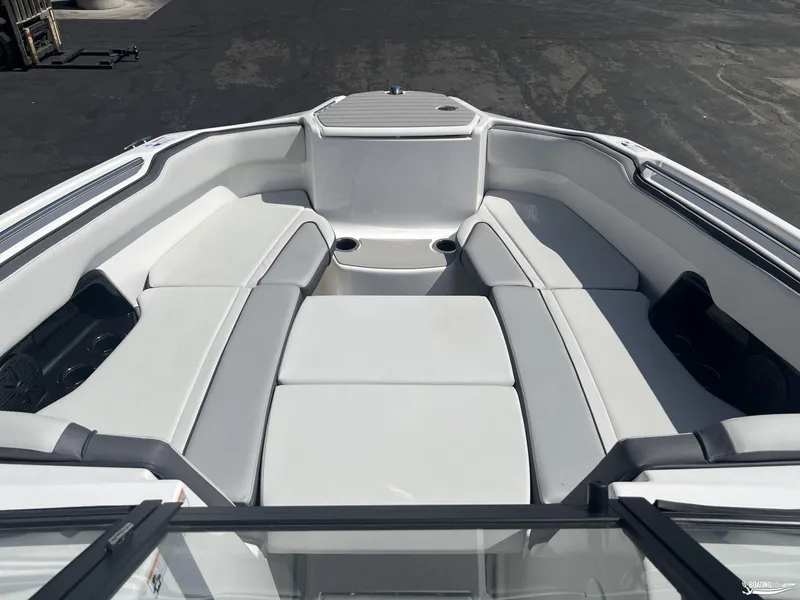 Slide: The Image of 2025 Yamaha AR250 boat interior with spacious seating and cup holders. - 6