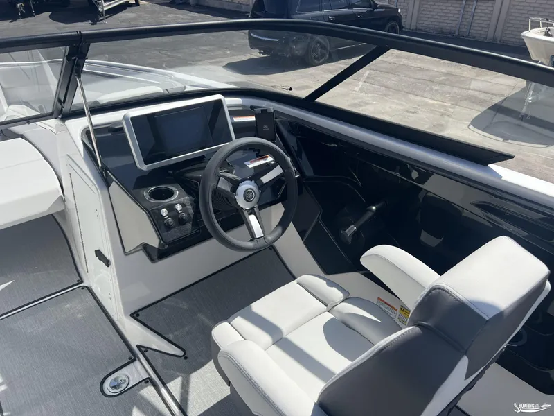 Slide: The Image of 2025 Yamaha Boats AR250 cockpit with modern steering and dashboard controls. - 7