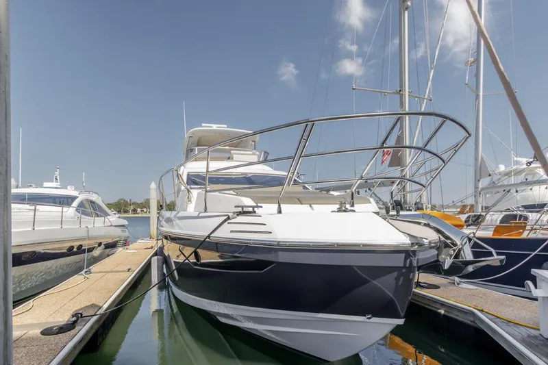 Slide: The Image of Azimut 60 Flybridge 2021 yacht docked at marina under clear sky. - 14