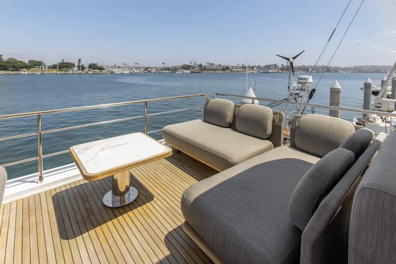 Slide: The Image of Luxurious Azimut 60 Flybridge 2021 yacht deck with elegant seating and scenic water view. - 32