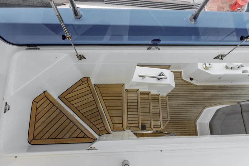 Slide: The Image of Azimut 60 Flybridge 2021 yacht, featuring elegant wooden steps and sleek design. - 34
