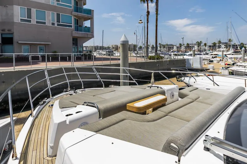 Slide: The Image of Azimut 60 Flybridge 2021 yacht docked, featuring spacious sunbathing area and modern design. - 35