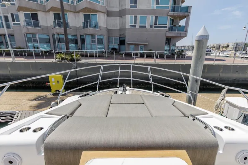 Slide: The Image of Azimut 60 Flybridge 2021 yacht docked near modern waterfront building. - 36