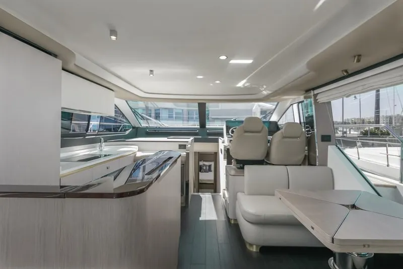 Slide: The Image of Luxurious interior of 2021 Azimut 60 Flybridge yacht with modern design and seating. - 41