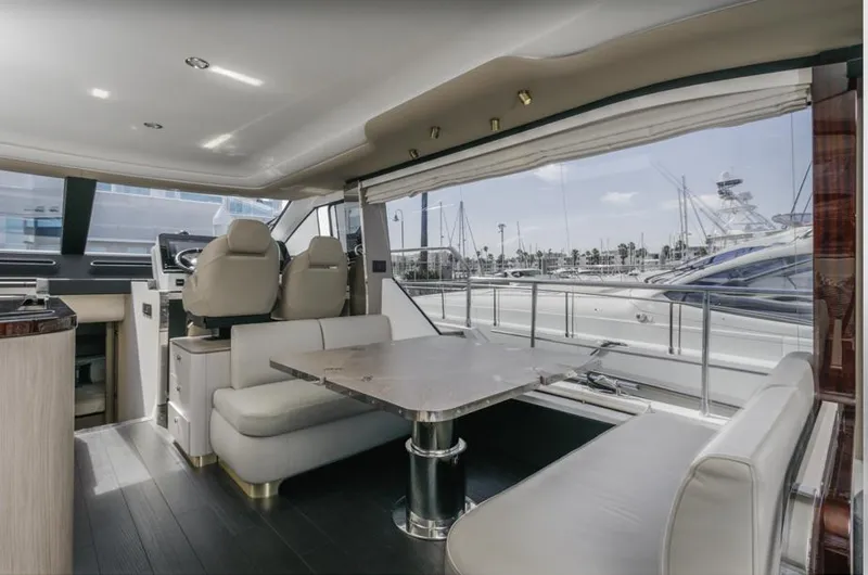 Slide: The Image of Luxurious interior of 2021 Azimut 60 Flybridge yacht with elegant seating and table. - 43