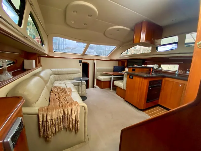 Slide: The Image of Luxurious interior of 2005 Cruisers Yachts 405 Express Motoryacht with leather seating and wood finishes. - 14