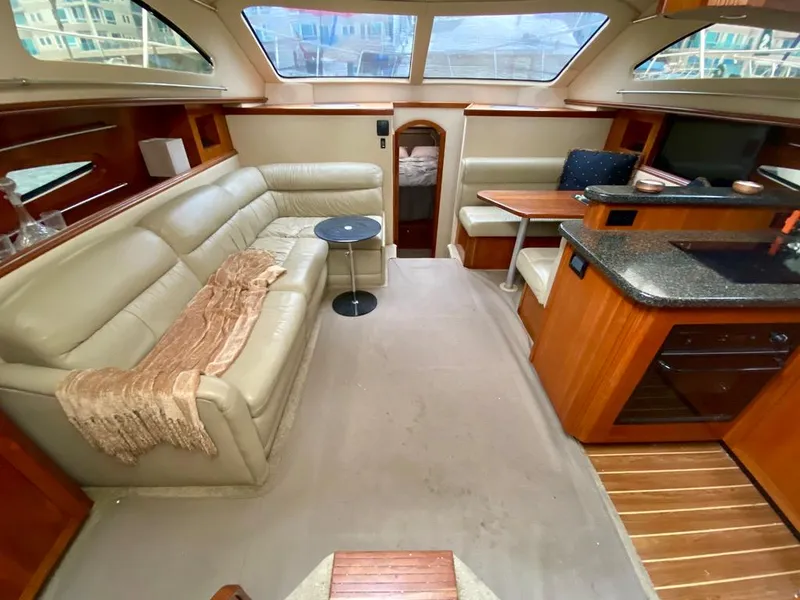 Slide: The Image of Luxurious interior of 2005 Cruisers Yachts 405 Express Motoryacht with leather seating and modern amenities. - 16