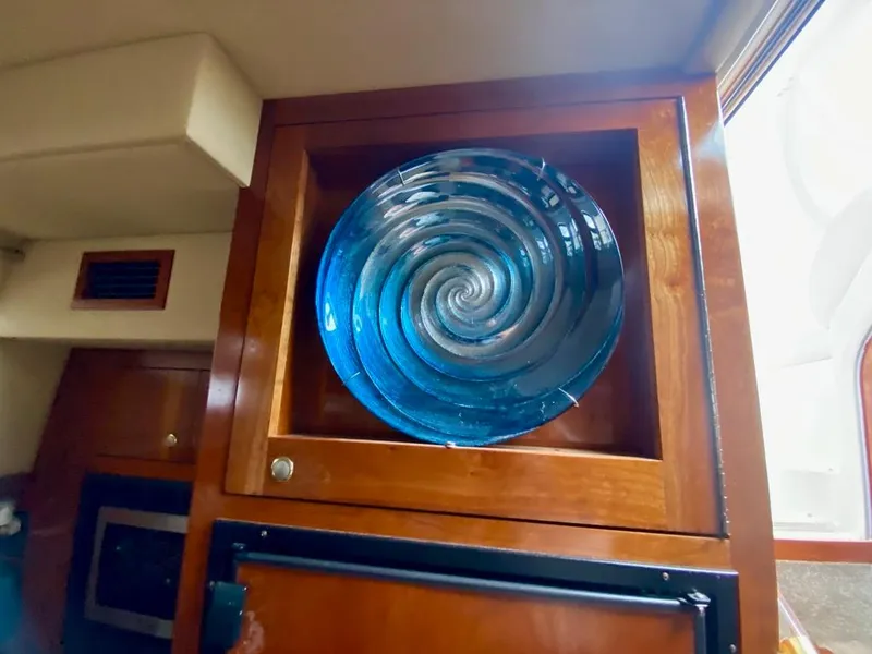 Slide: The Image of Decorative blue glass plate in 2005 Cruisers Yachts 405 Express Motoryacht interior. - 23
