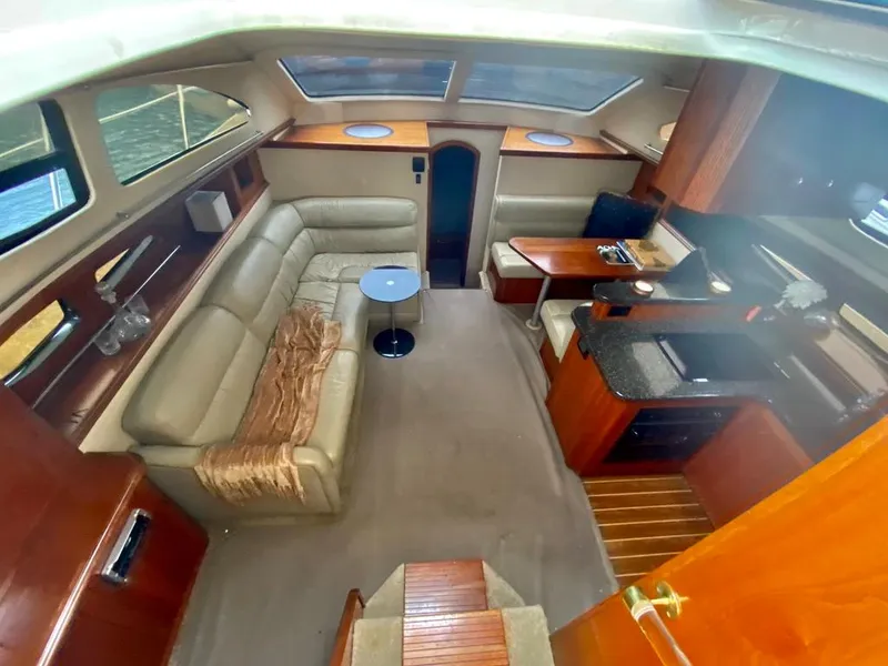 Slide: The Image of Luxurious 2005 Cruisers Yachts 405 Express Motoryacht interior with elegant seating and modern amenities. - 24